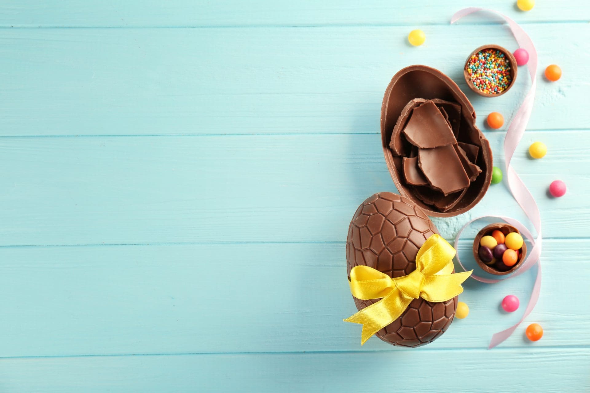 Photo of Chocolate Easter Eggs on turquoise blue background
